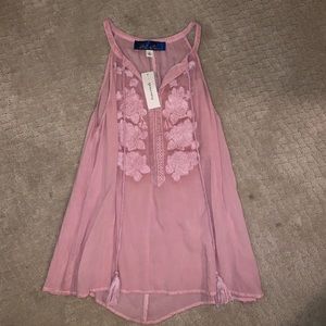 Never worn with tag! Just not my style anymore!